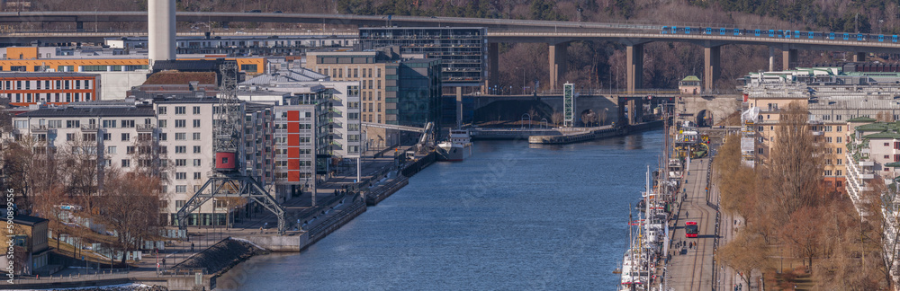 The pier Hammarby kaj, apartment houses a port mill, a sunny spring day in Stockholm