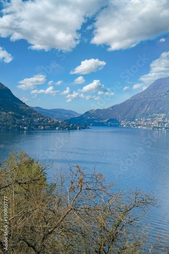 Como city in Italy  view of the city from the lake  with mountains in background 