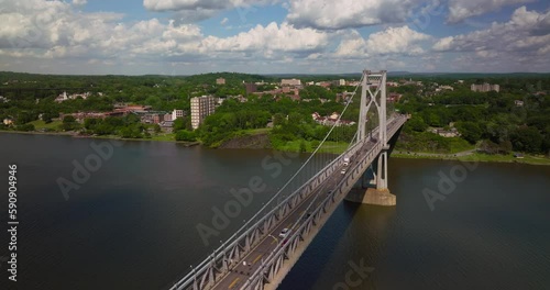 Aerial of traffic on Mid Hudson Bridge over Hudson River in Poughkeepsie New York on Bright Sunny Summer Day