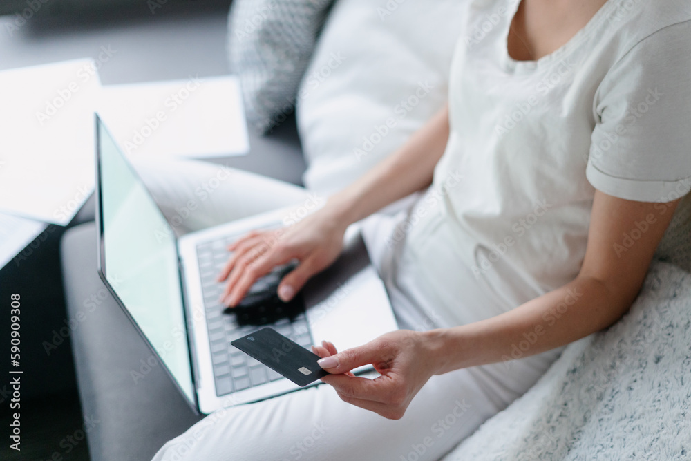 woman using notebook computer and shopping online woman using notebook computer and shopping online