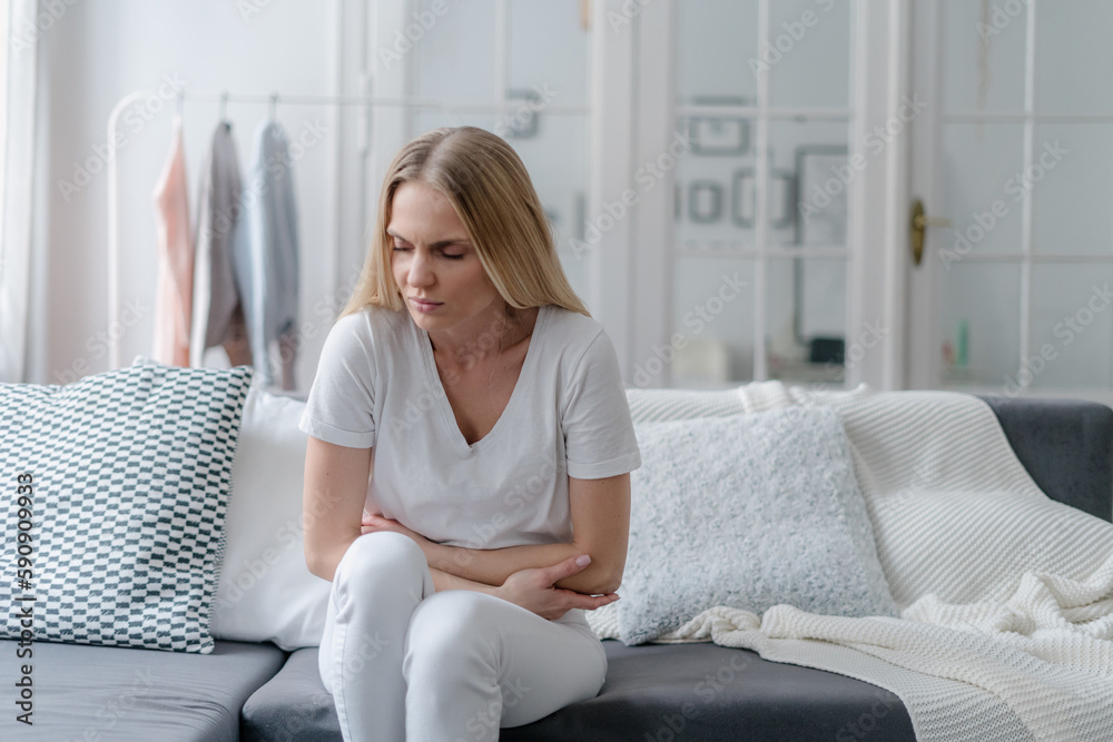 woman suffering from strong abdominal menstrual pain woman suffering from strong abdominal menstrual pain
