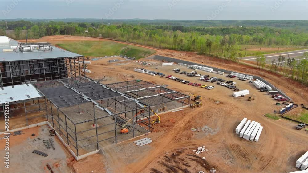 Construction an industrial warehouse building truss frame steel as part in construction site Construction an industrial warehouse building truss frame steel as part in construction site
