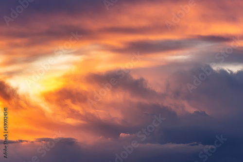 Beautiful storm cumulus clouds in the sky during sunrise or sunset, background