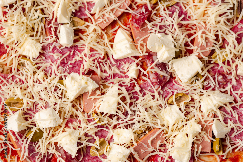 Raw homemade pizza close-up. Pizza background with mozzarella cheese and salami. Raw homemade pizza close-up. Pizza background with mozzarella cheese and salami.