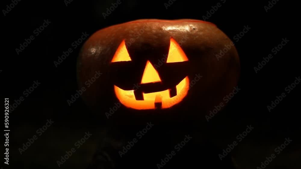 Funny Halloween pumpkin face with glowing candle. Funny Halloween pumpkin face with glowing candle.