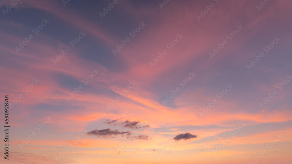Beautiful sky with pink clouds at sunset as natural background.