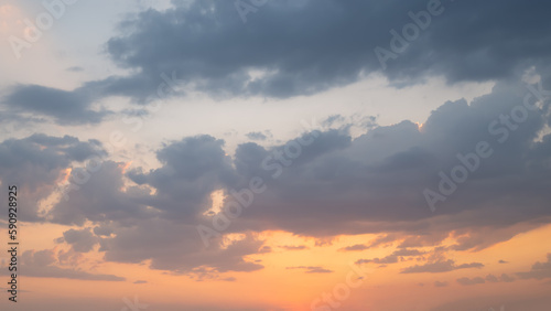 Orange blue sky with clouds at beautiful sunset as natural background.
