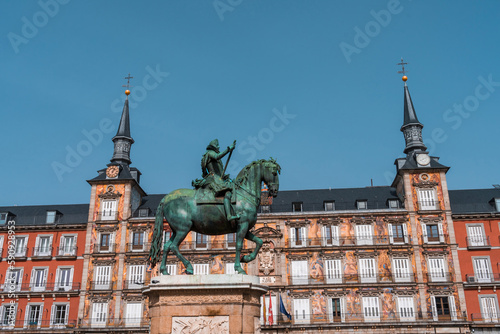 Colorful buildings and statue of Plaza Mayor