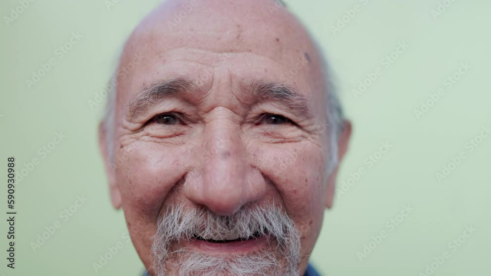 Portrait of happy senior man looking at camera outdoors - Joyful elderly lifestyle