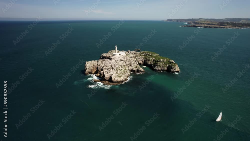 Aerial drone approaching Mouro Island Lighthouse, Santander, Cantabria, Spain, Europe Aerial drone approaching Mouro Island Lighthouse, Santander, Cantabria, Spain, Europe
