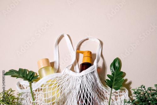 the natural body care bottle with bamboo lid. sustainable package with leaves . wellness and spa concept .