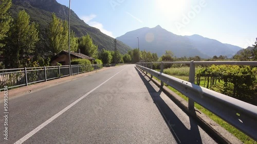 Via Francigena - paved road after Donnas town, Aosta Valley, Italy photo