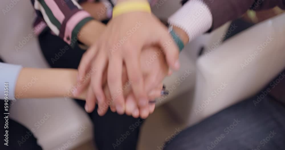 Close up successful business team stacking hands together. Colleagues celebrating and smiling in an office. Out of focus people at the end of video. Close up successful business team stacking hands together. Colleagues celebrating and smiling in an office. Out of focus people at the end of video.