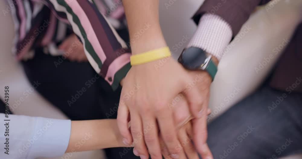 Close up successful business team stacking hands together. Colleagues celebrating and smiling in an office. Close up successful business team stacking hands together. Colleagues celebrating and smiling in an office.