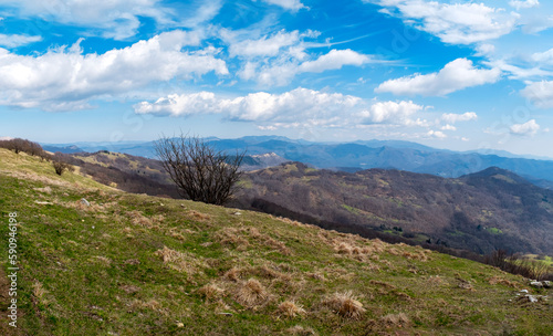 Springtime panorama of the Ligurian Apennines, towards the Piedmont side, seen from the top of Antola mountain; is a small peak on the borders between Piedmont and Liguria (Northern Italy).