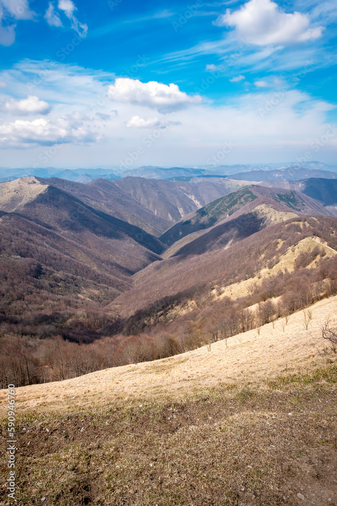 Springtime panorama of the Ligurian Apennines, towards the Piedmont side, seen from the top of Antola mountain; is a small peak on the borders between Piedmont and Liguria (Northern Italy). Springtime panorama of the Ligurian Apennines, towards the Piedmont side, seen from the top of Antola mountain; is a small peak on the borders between Piedmont and Liguria (Northern Italy).