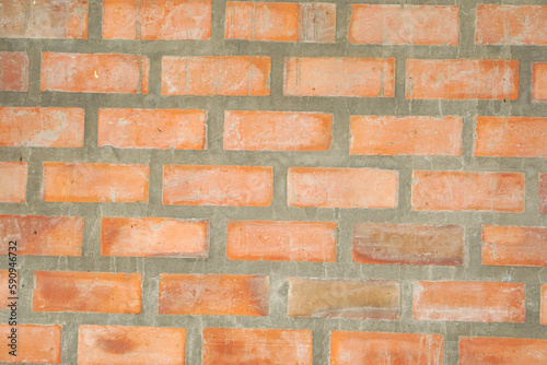 Brown block brick wall background, building wall