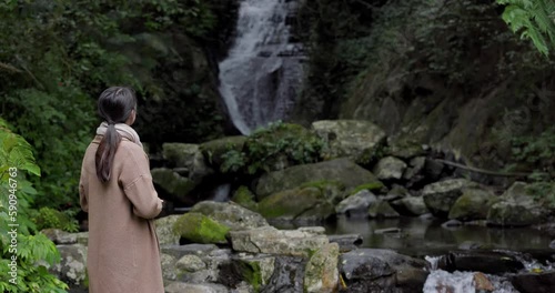 Tourist woman go hiking view the Wufengqi waterfall in Yilan of Taiwan photo