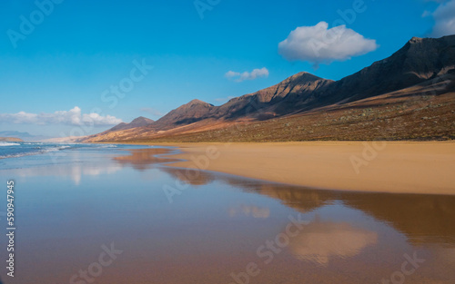 Cofete beach and beautiful reflections in the ocean water on Fuerteventura, Spain - Canary Islands