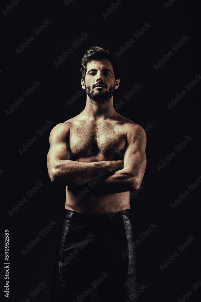 Portrait of shirtless man with arms crossed