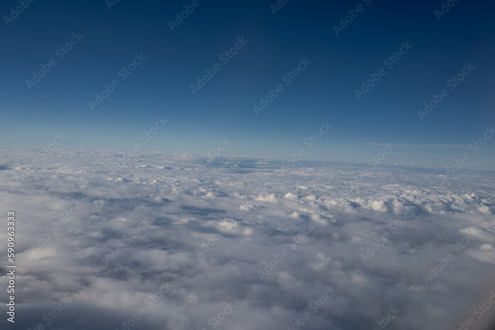 a clear blue sky over thick cloud cover at 30,000 feet a clear blue sky over thick cloud cover at 30,000 feet