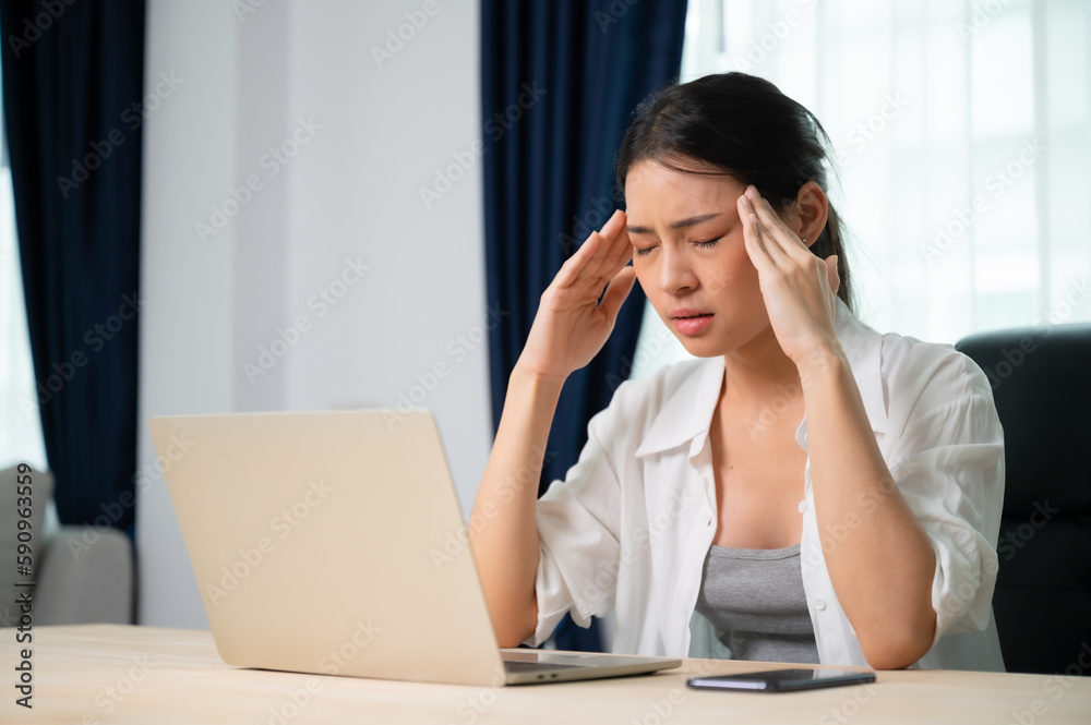 Office syndrome. Overworked tired young asian woman feeling headache, having eyesight problem after computer laptop work. Stressed young woman suffering from fatigue at home Office syndrome. Overworked tired young asian woman feeling headache, having eyesight problem after computer laptop work. Stressed young woman suffering from fatigue at home