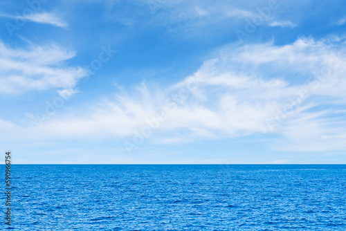 Blue sea and white clouds on sky. Water cloud horizon background. Feeling calm, cool, relaxing. The idea for cold background and copy space on the top. the ocean deep indigo
