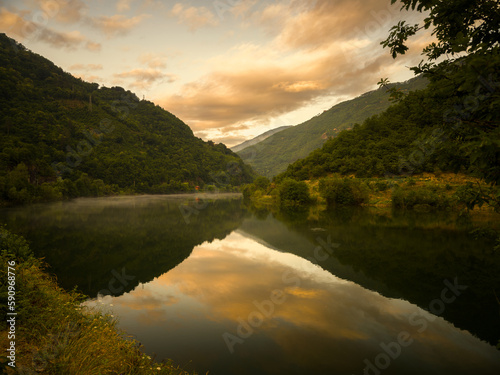 Big river view at sunrise or sunset. Coruh river in the Turkey. Still water image on a calm summer day
