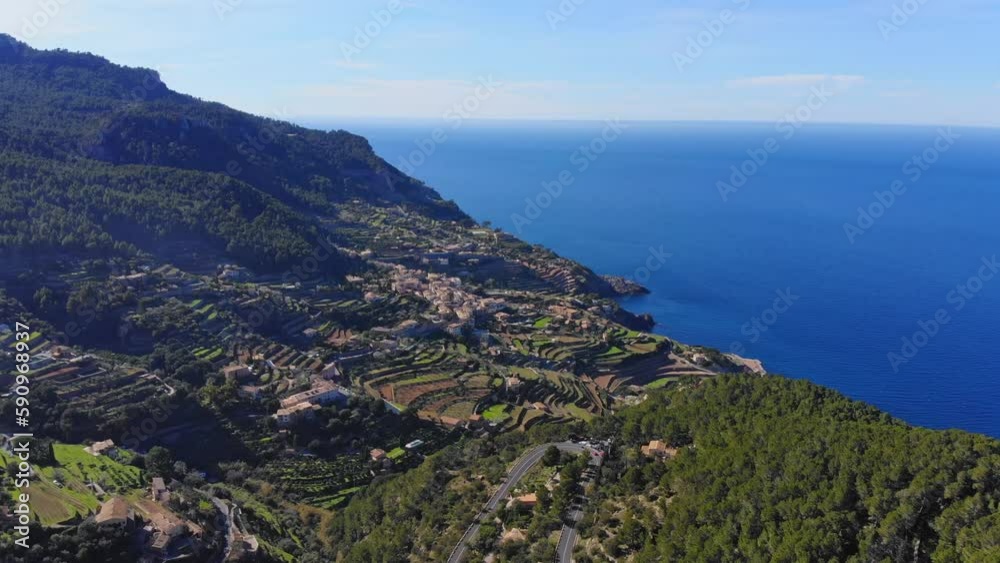Drone shot of a beautiful view over a village on the west coast of Mallorca Island. Drone shot of a beautiful view over a village on the west coast of Mallorca Island.