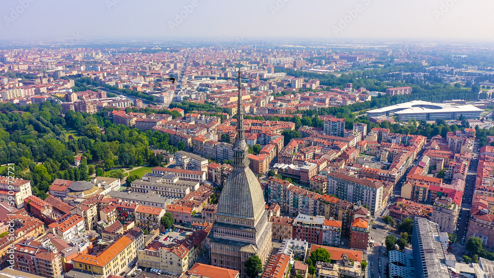 Turin, Italy. Flight over the city. Mole Antonelliana - a 19th-century building with a 121 m high dome and a spire, Aerial View