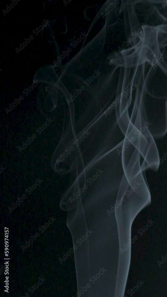 Slow motion vertical video of white smoke, fog, mist, vapor on a black background. Slow motion vertical video of white smoke, fog, mist, vapor on a black background.