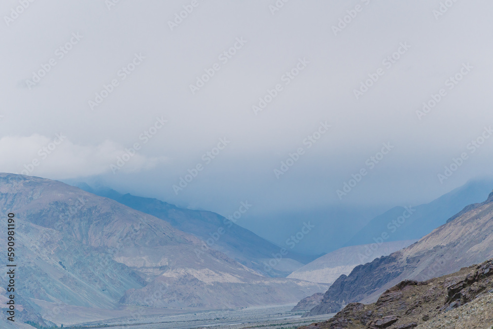 rolling hills and clouds on the top of the mountain at Ladakh, Leh, India