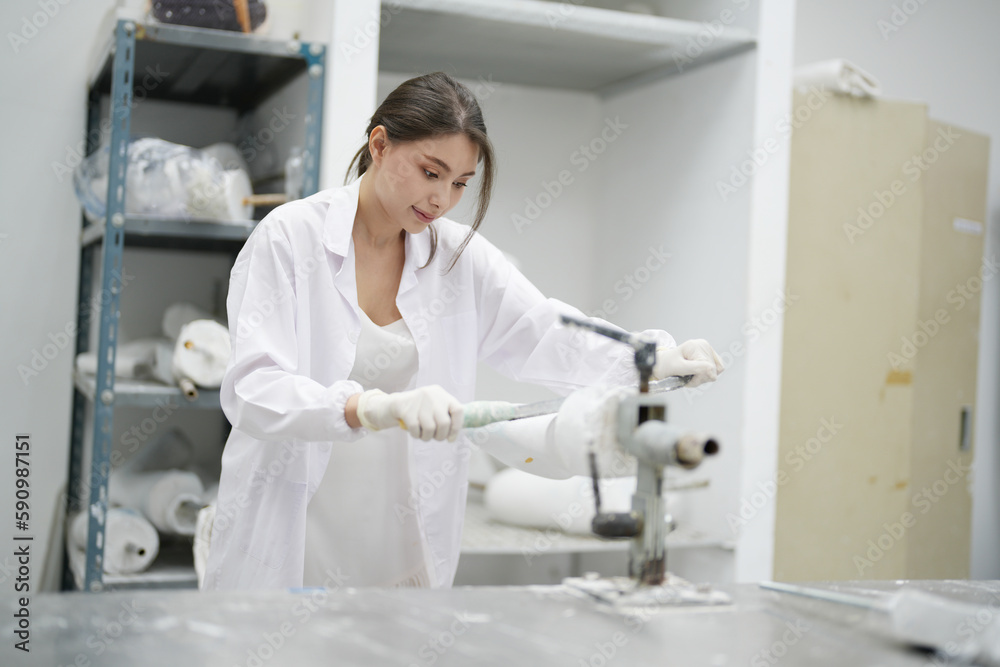 Fototapeta premium Orthopedic technician making prosthetic leg for disabilities people in workshop.