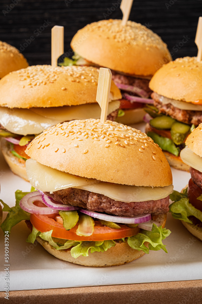 small burgers on the catering table small burgers on the catering table