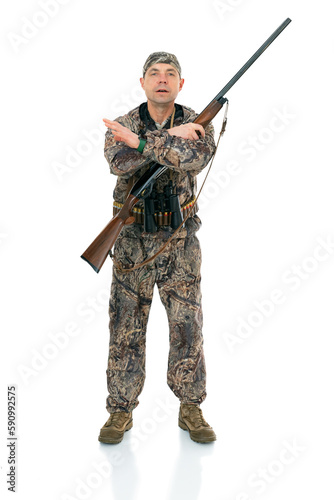 Full length portrait of duck hunter with a rifle and binoculars crossed hand and showing refusal gesture, isolated on white background. Guy in hunting uniform showing stop gesture, way prohibited.