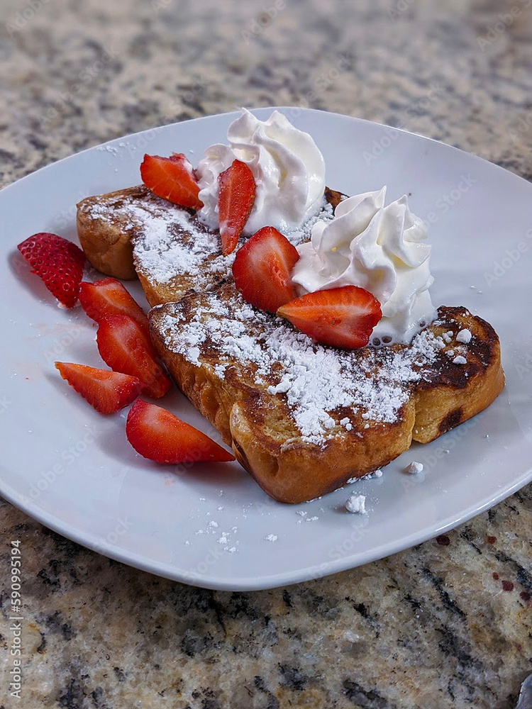 Delicious Breakfast French Toast with Whipped Cream and Strawberries Delicious Breakfast French Toast with Whipped Cream and Strawberries