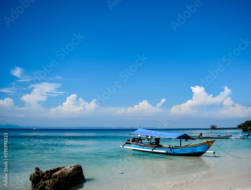 Boat on the beach, tourist transportation.