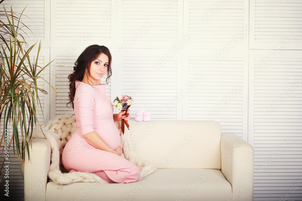 Beautiful pregnant girl with a big belly. Young married pregnant couple. Husband with a pregnant wife. A couple awaiting the birth of a baby. Beautiful pregnant girl with a big belly. Young married pregnant couple. Husband with a pregnant wife. A couple awaiting the birth of a baby.