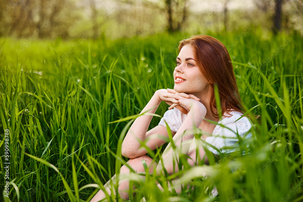 sunny summer day, a beautiful young woman lying on the grass sunny summer day, a beautiful young woman lying on the grass