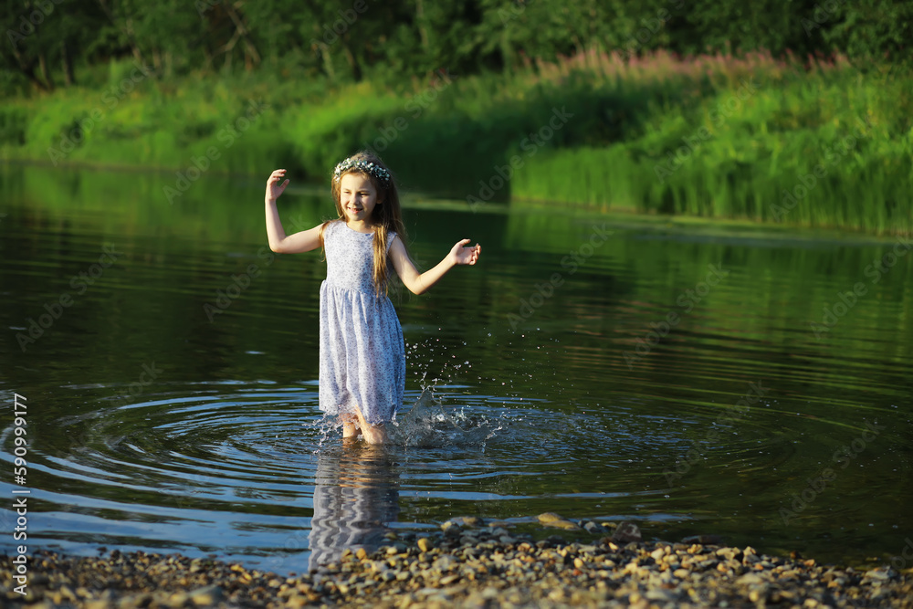 Children walk in the summer in nature. Child on a sunny spring morning in the park. Traveling with children. Children walk in the summer in nature. Child on a sunny spring morning in the park. Traveling with children.