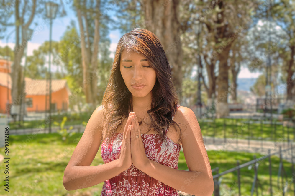 Faith and Nature: Latina Woman Praying in La Paz Park