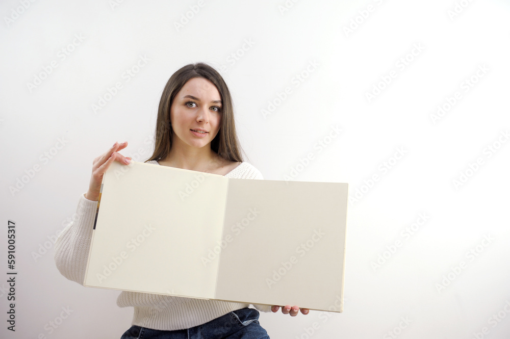 Portrait of a young woman with blank billboard isolated on white background. High quality photo Portrait of a young woman with blank billboard isolated on white background. High quality photo