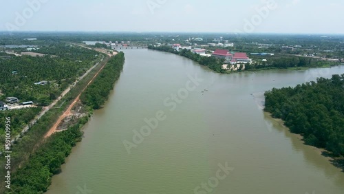 Wallpaper Mural Above the countryside and wild forest waterside landscape. The flying environment plants the greenery forest and riverside.  Daytime aerial view of Bang Pakong River in Chachoengsao province, Thailand Torontodigital.ca