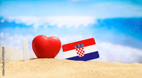 Fototapeta Naklejka Na Ścianę i Meble -  I love Croatia. Flag of Croatia on the beach with a red heart. vacation and travel concept.