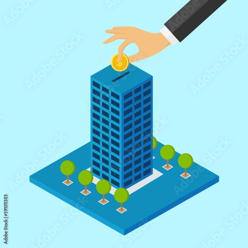 property investment, business man’s hand putting a coin into a skyscraper 