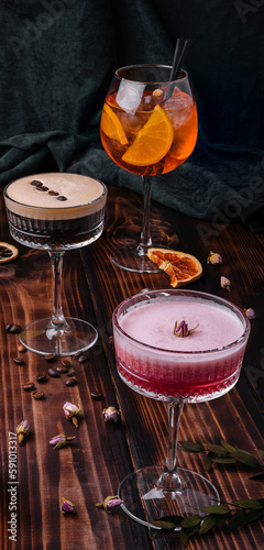 different colorful exotic alcoholic cocktails on wood