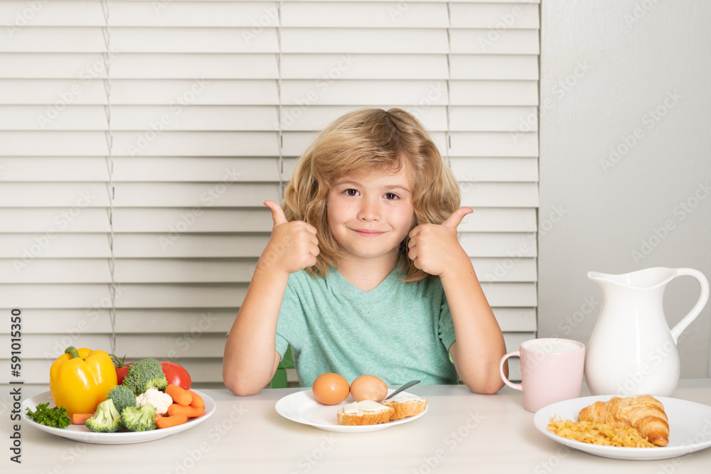 Kid boy eating healthy food vegetables. Breakfast with milk, fruits and vegetables. Child eating during lunch or dinner. Kid boy eating healthy food vegetables. Breakfast with milk, fruits and vegetables. Child eating during lunch or dinner.