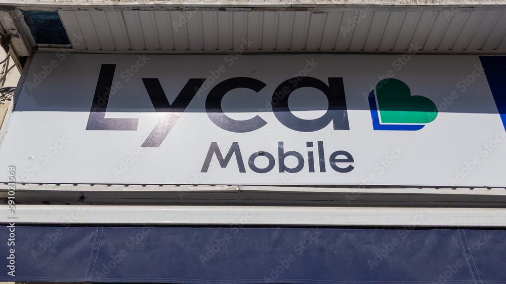 Lycamobile logo text and brand sign of mobile virtual network operator lowcost on store facade
