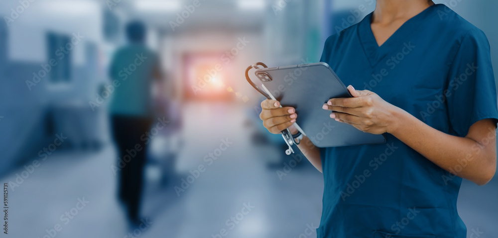 female doctor standing with digital tablet working inside modern clinic office, 