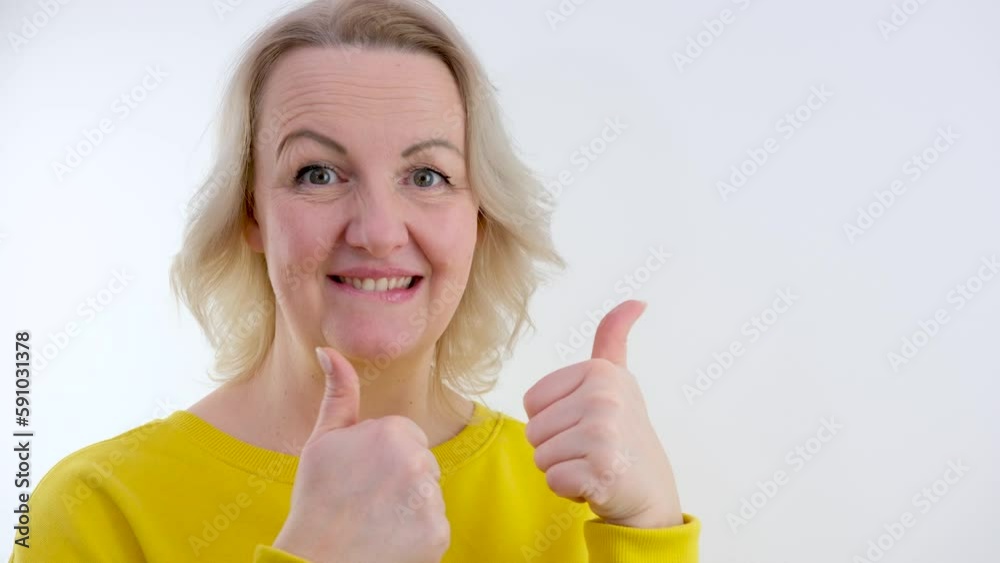 Young cheerful girl pointing empty place on her palm and smiling at the camera. Attractive woman showing empty space for commercial image. People lifestyle. High quality 4k footage Young cheerful girl pointing empty place on her palm and smiling at the camera. Attractive woman showing empty space for commercial image. People lifestyle. High quality 4k footage